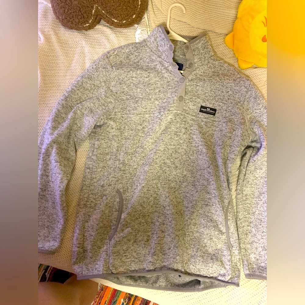 Women’s grey fleece half button pullover.
